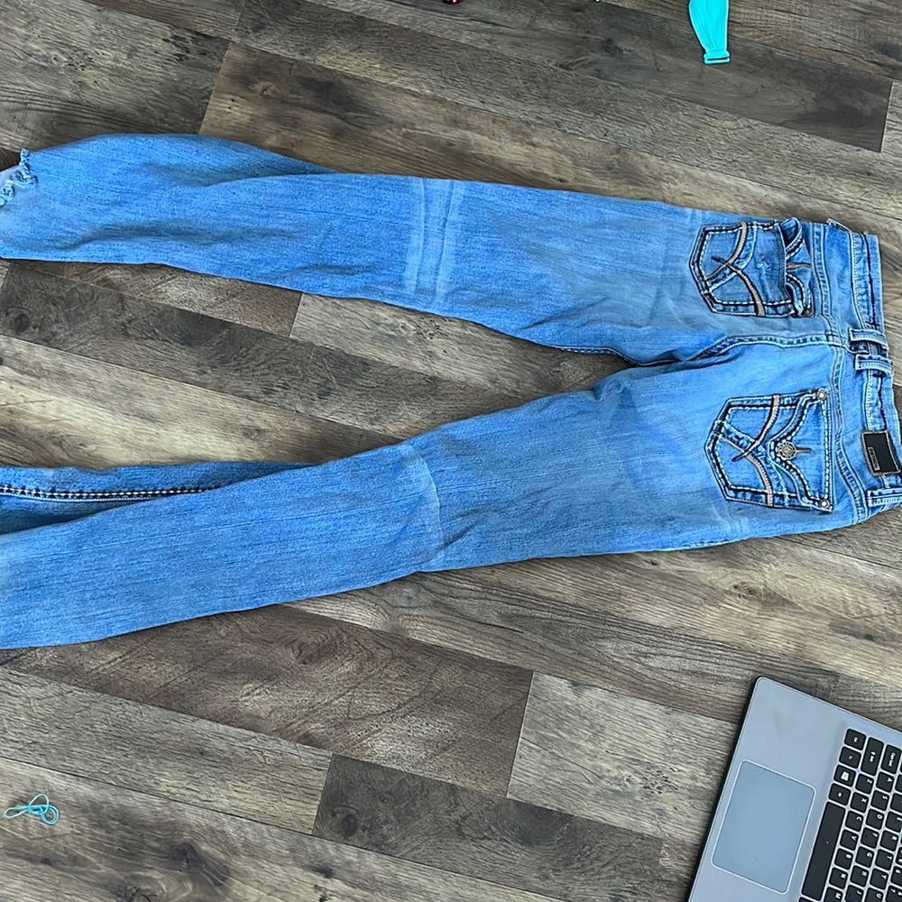 light blue petrol jeans, size 9 one button missing on pants